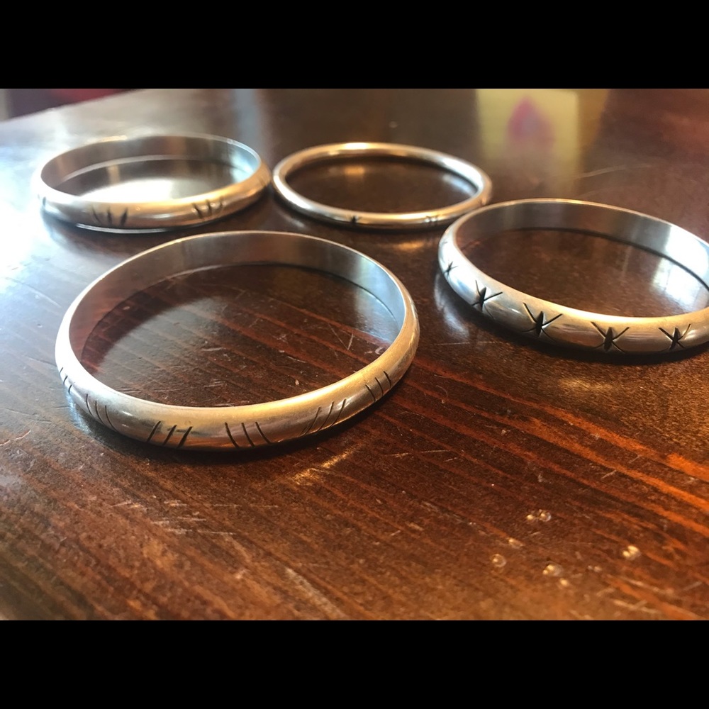 4 silver bracelets